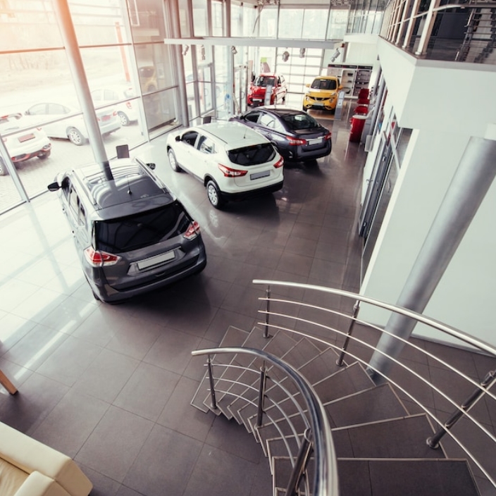 Car insurance at a car dealership or buying a policy online